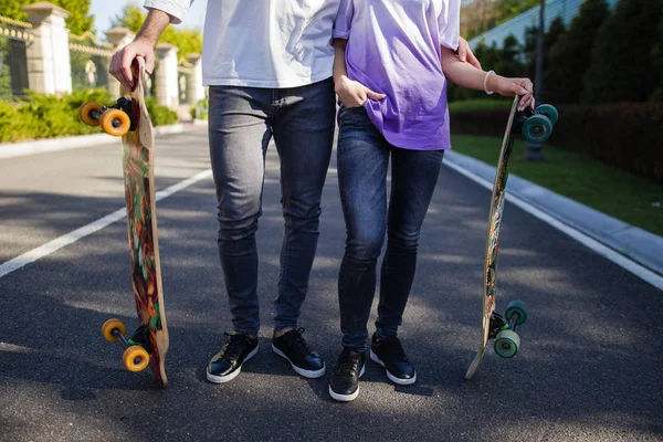 Young skateboarders on road — Stock Photo, Image