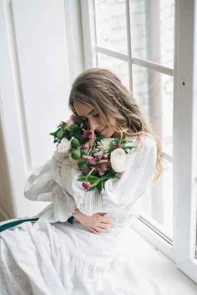 Young girl near window — Stock Photo, Image