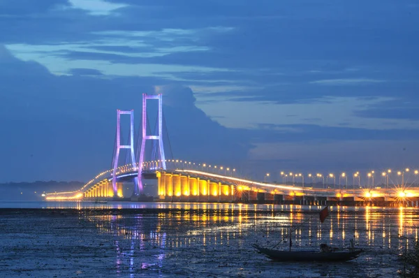 The Suramadu Bridge at Twilight with colorful lighting in Surabaya,Indonesia.Is the longest Bridge in Indonesia.