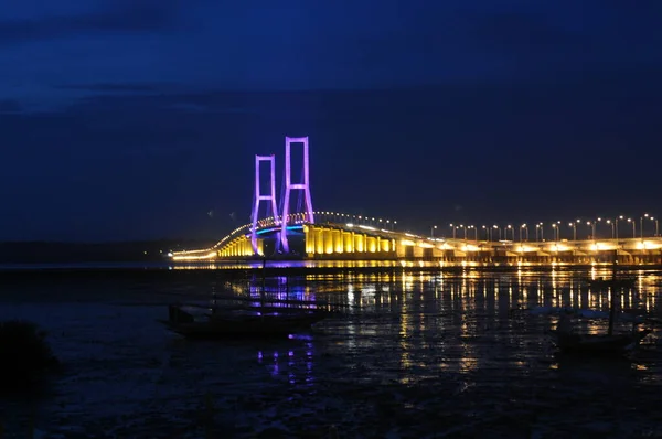 The Suramadu Bridge at Twilight with colorful lighting in Surabaya,Indonesia.Is the longest Bridge in Indonesia.