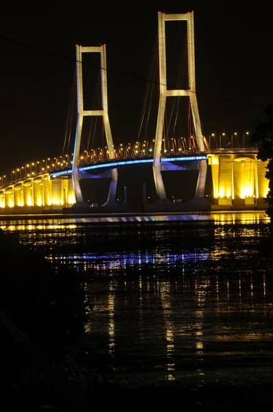 The Suramadu Bridge at Twilight with colorful lighting in Surabaya,Indonesia.Is the longest Bridge in Indonesia.