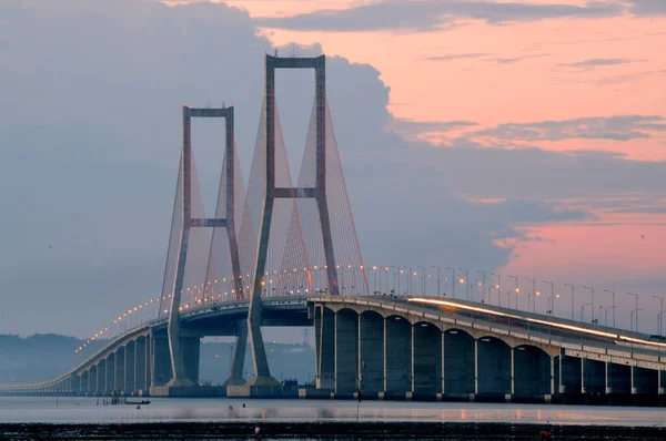 The Suramadu Bridge at Twilight with colorful lighting in Surabaya,Indonesia.Is the longest Bridge in Indonesia.