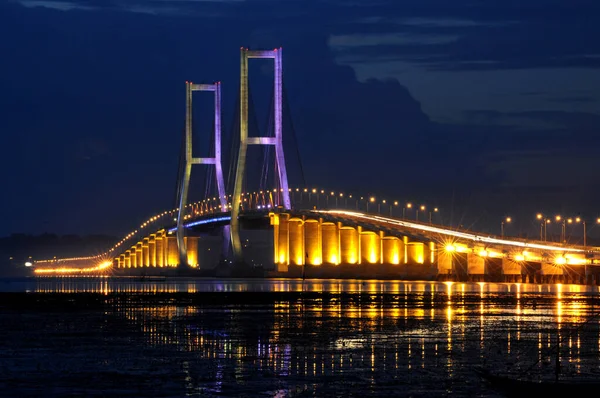 The Suramadu Bridge at Twilight with colorful lighting in Surabaya,Indonesia.Is the longest Bridge in Indonesia.