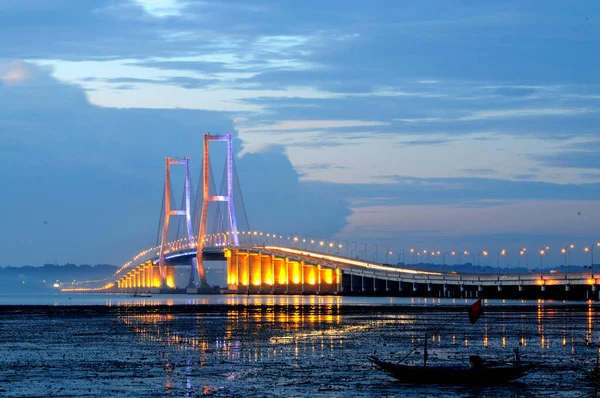 The Suramadu Bridge at Twilight with colorful lighting in Surabaya,Indonesia.Is the longest Bridge in Indonesia.