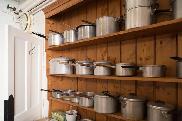 Saucepans on shelf — Stock Photo, Image