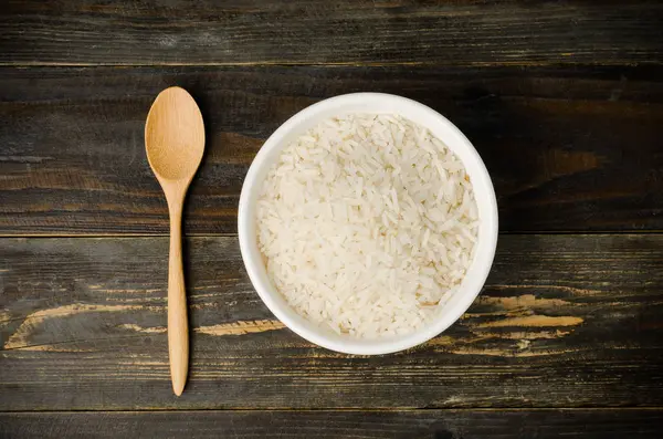 Sementes de arroz em uma tigela — Fotografia de Stock