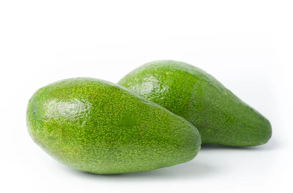 Плоды авокадо на белом фоне — стоковое фото