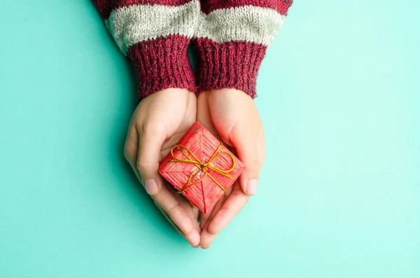 Red gift box in hand for giving in special day