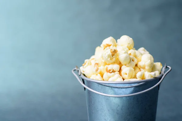 Caramel popcorn in a bucket, delicious snack