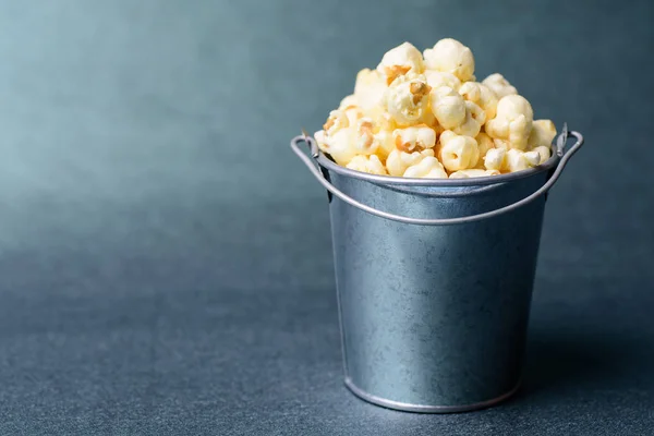 Caramel popcorn in a bucket, delicious snack