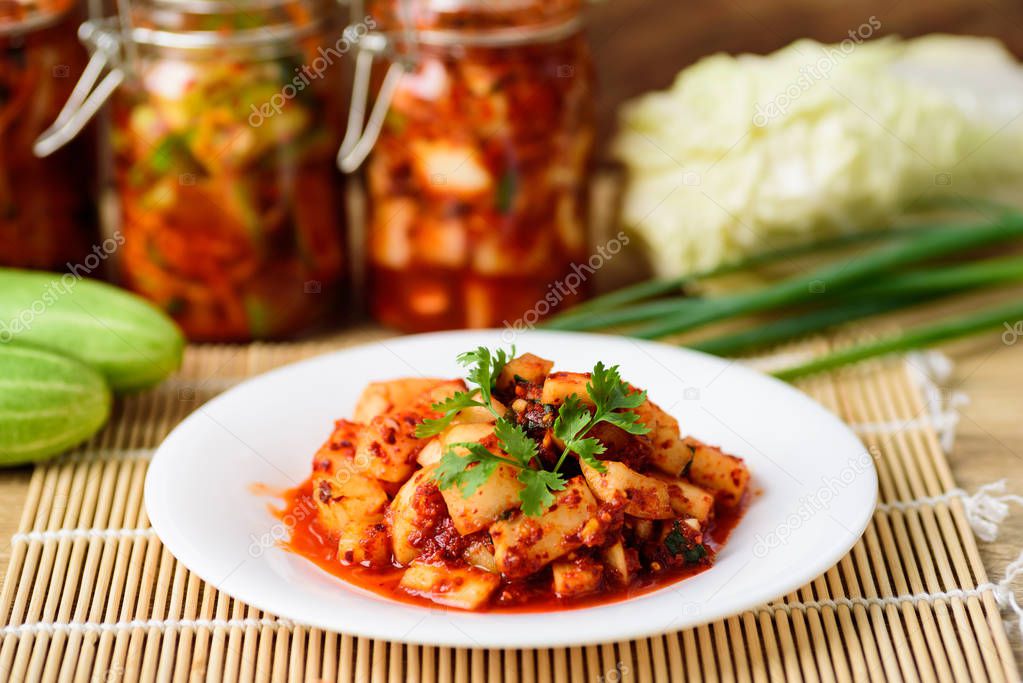 Kimchi radish on white plate, homemade Korean food