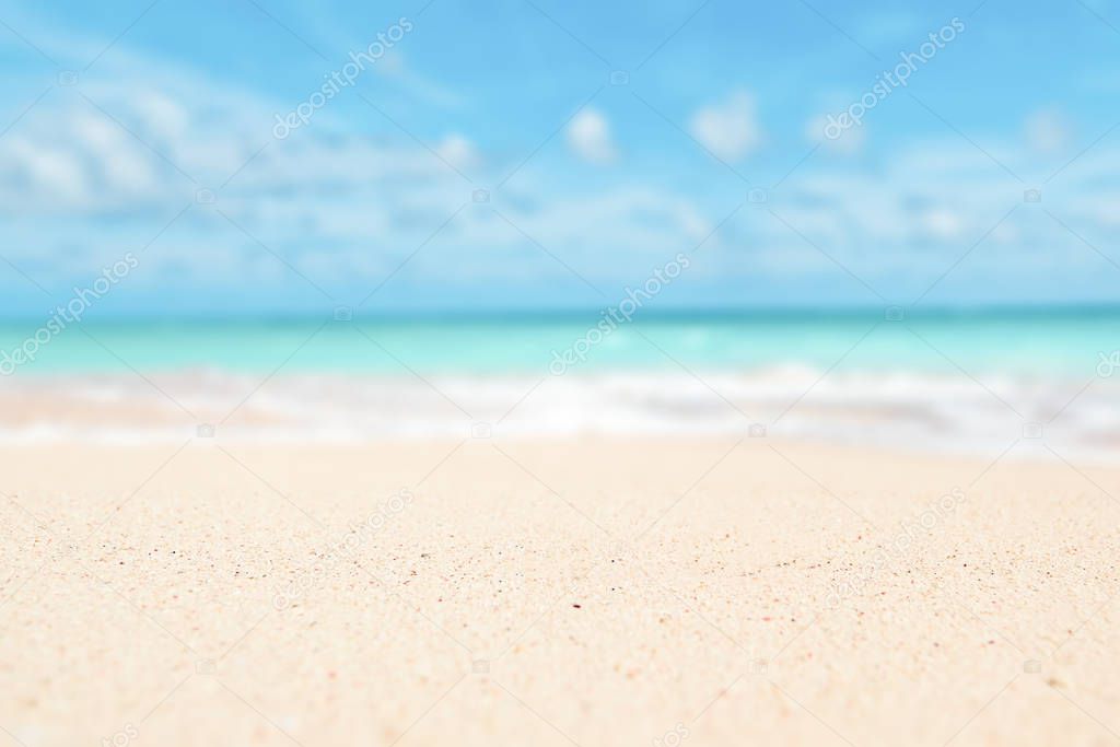 Sand, sky, sea summer concept with defocused backgroound