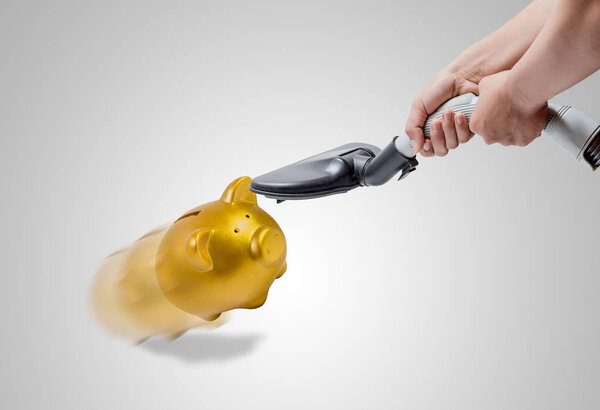 Piggy bank is sucked by a vacuum cleaner, conceptual idea