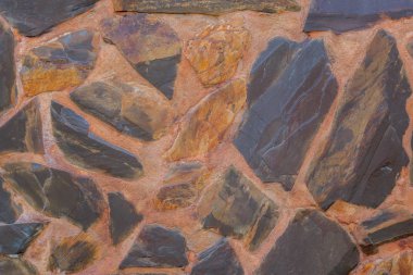 Arka plan duvar kaba siyah ve kahverengi taştan