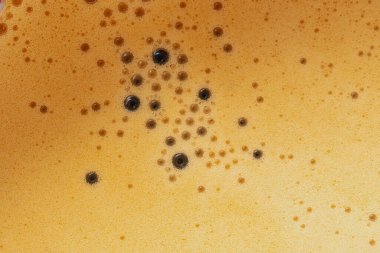 Köpük krema kahve deseni makro arka plan sıcak kahve, yakın çekim üst görünüm