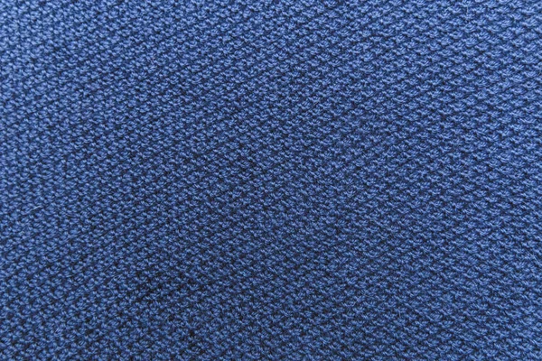 Sfondo in tessuto blu lavorato.Texture lavorata a maglia con motivo . — Foto Stock