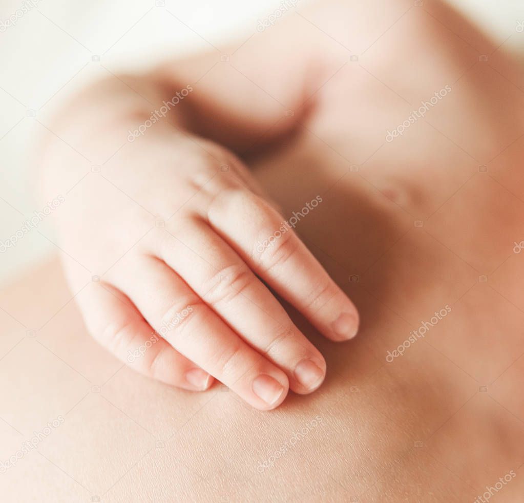 The Part of Body of Newborn Cute Baby.Hand with Touching Fingers.Detail.