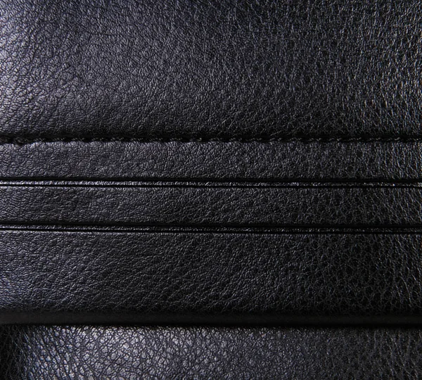 Schwarzer Lederhintergrund mit Rändern, raues Muster — Stockfoto