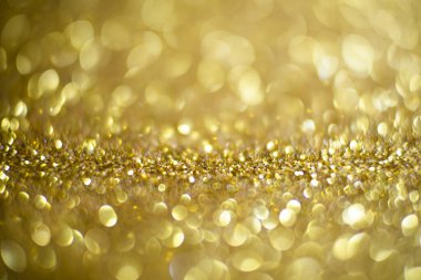 Parlak ve ışıl ışıl bir arka plan. Altın ve elmas tozu bokeh - parıltı dokusundan gelen bulanık ışık. Mavi renkli lüks tasarım arka planı. Altın renkli ışıltılı arka plan Bokeh altın ışıklarıyla.