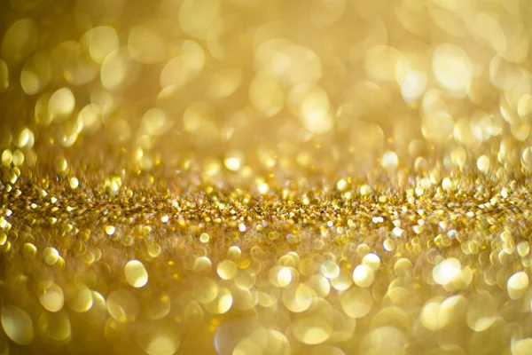 Parlak ve ışıl ışıl bir arka plan. Altın ve elmas tozu bokeh - parıltı dokusundan gelen bulanık ışık. Mavi renkli lüks tasarım arka planı. Altın renkli ışıltılı arka plan Bokeh altın ışıklarıyla.