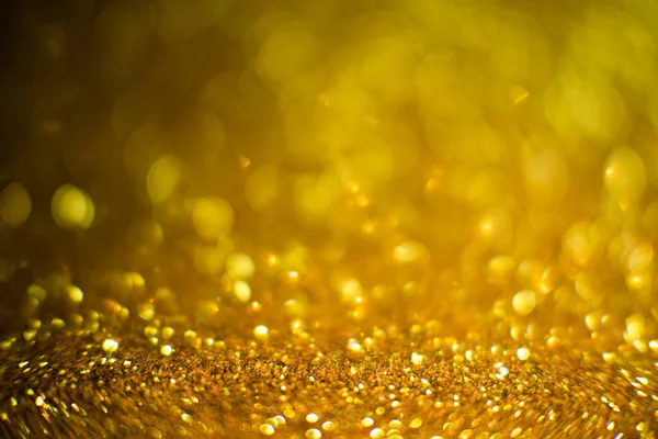 明るく輝くボケの背景の要旨 黄金とダイヤモンドのダストボケ 輝きのテクスチャからのぼやけた照明 ブルーカラー高級デザインの背景 金色のライトを持つ金のお祝いの輝きの背景 — ストック写真