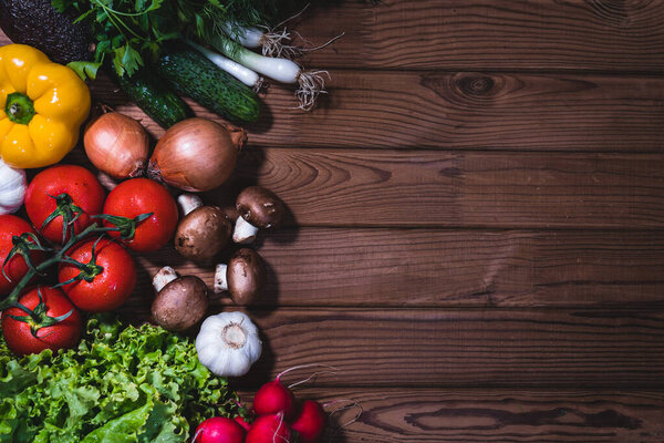 Healthy eating background. Set of vegetables on dark old wooden table with top-down copy space frame, banner on the right. Shopping food supermarket and clean vegan eating concept.