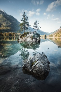 Scenic image at the Mountain lake Hintersee in the Bavarian Alps during a vibrant sunny Sunrise. Hintersee lake, Bavaria. Germany clipart