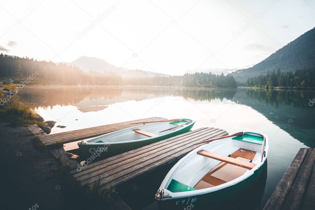 First morning light touching the boats at Hintersee Lake, Berchtesgaden, Germany