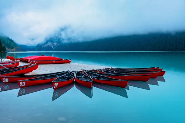 Beautiful Red Canoes Docked Lake Louise Foggy Morning Alberta Canada — 스톡 사진