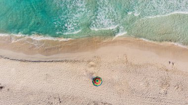 Lonely beach umbrella at Tulum beach Mexico North America clipart