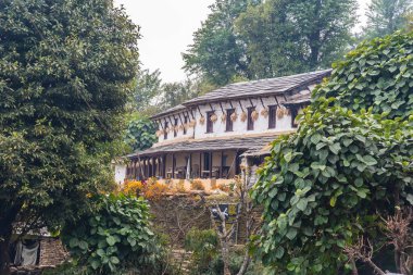 Beautiful Gurung village house at Ghandruk Pokhara region Nepal clipart