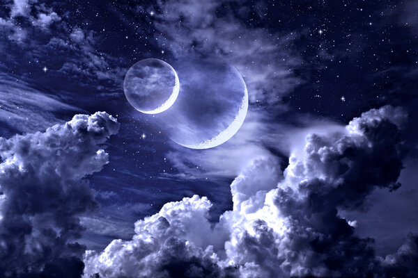 Double moon on a fabulous cloudy sky