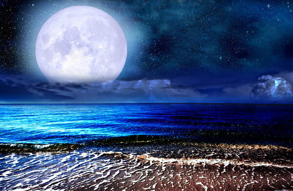 Full moon over the sea and starry sky