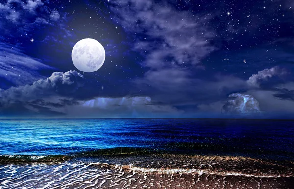 Full moon over the sea and starry sky