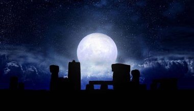 Full moon and starry sky over stonehenge