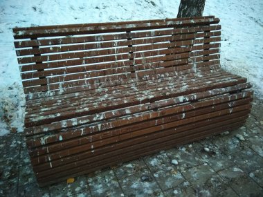 a bench stained with pigeon droppings clipart