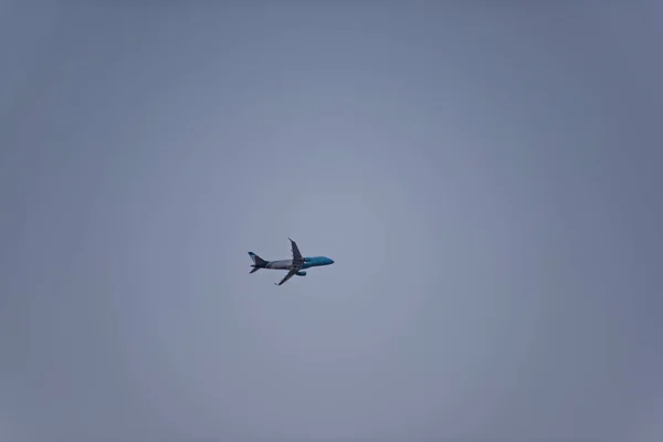 Canceling flights during quarantine. The plane is in the sky. The tourist plane is transporting people on vacation.