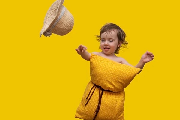 Beautiful Little Girl Yellow Pillow Her Belt Catching Flying Hat — Stock Photo, Image