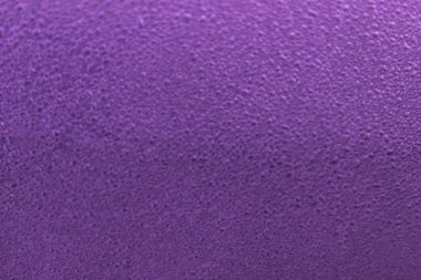 Blured texture of water droplets. Rain drop on purple surface. Bright background or wallpaper. 
