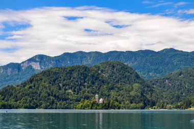 Wildlife. Mountain lake Bled on a sunny day in Slovenia. With a small island with a church.