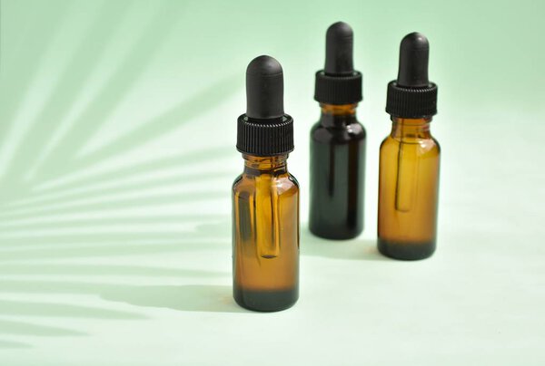 Beauty products from nature, aromatherapy, dropper bottles with cosmetic oil for skin treatment, mock up.