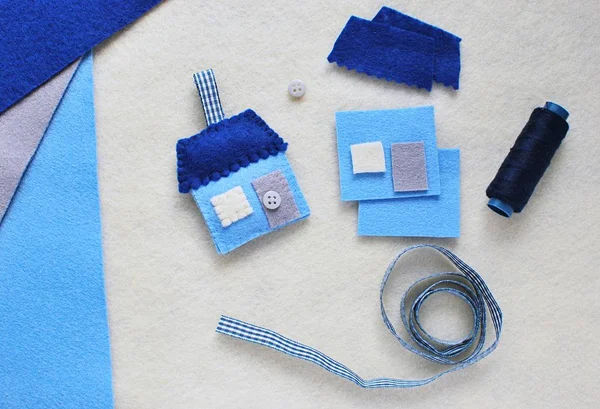 Felt crafts. Little blue house key chain. Crafts for kids. Felt toy. Craft tools and instruction how to make house key chain.