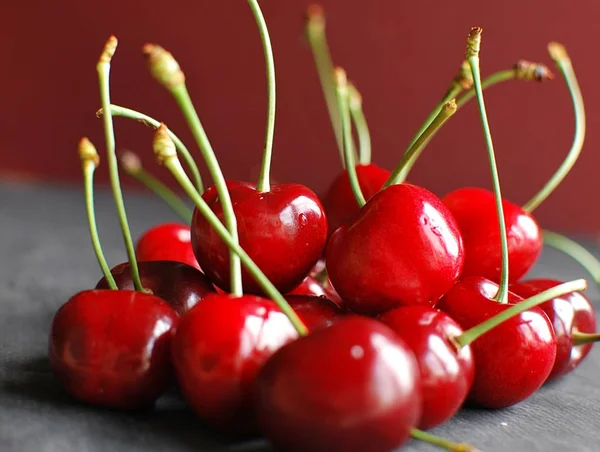 Fresh wild cherries. Black cherry berries on the table.