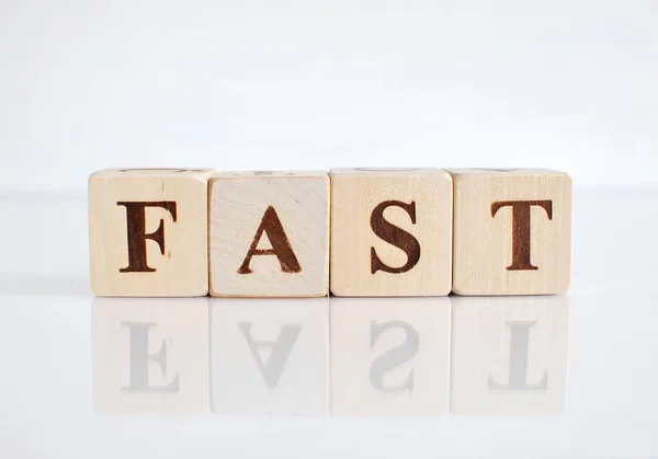 Word Fast Wooden Blocks Close View White Background Reflection — Stock Photo, Image