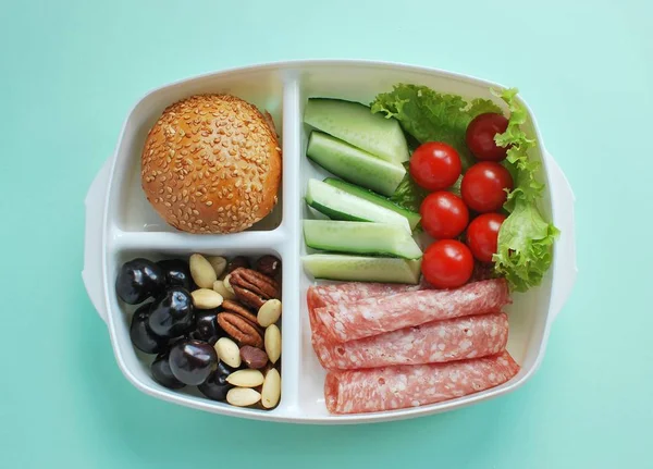 School lunch box with note. Healthy snacks in lunchbox.