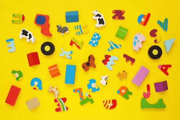 Set Small Colorful Wooden Kids Toys Yellow Background Toy Pattern — Stock Photo, Image