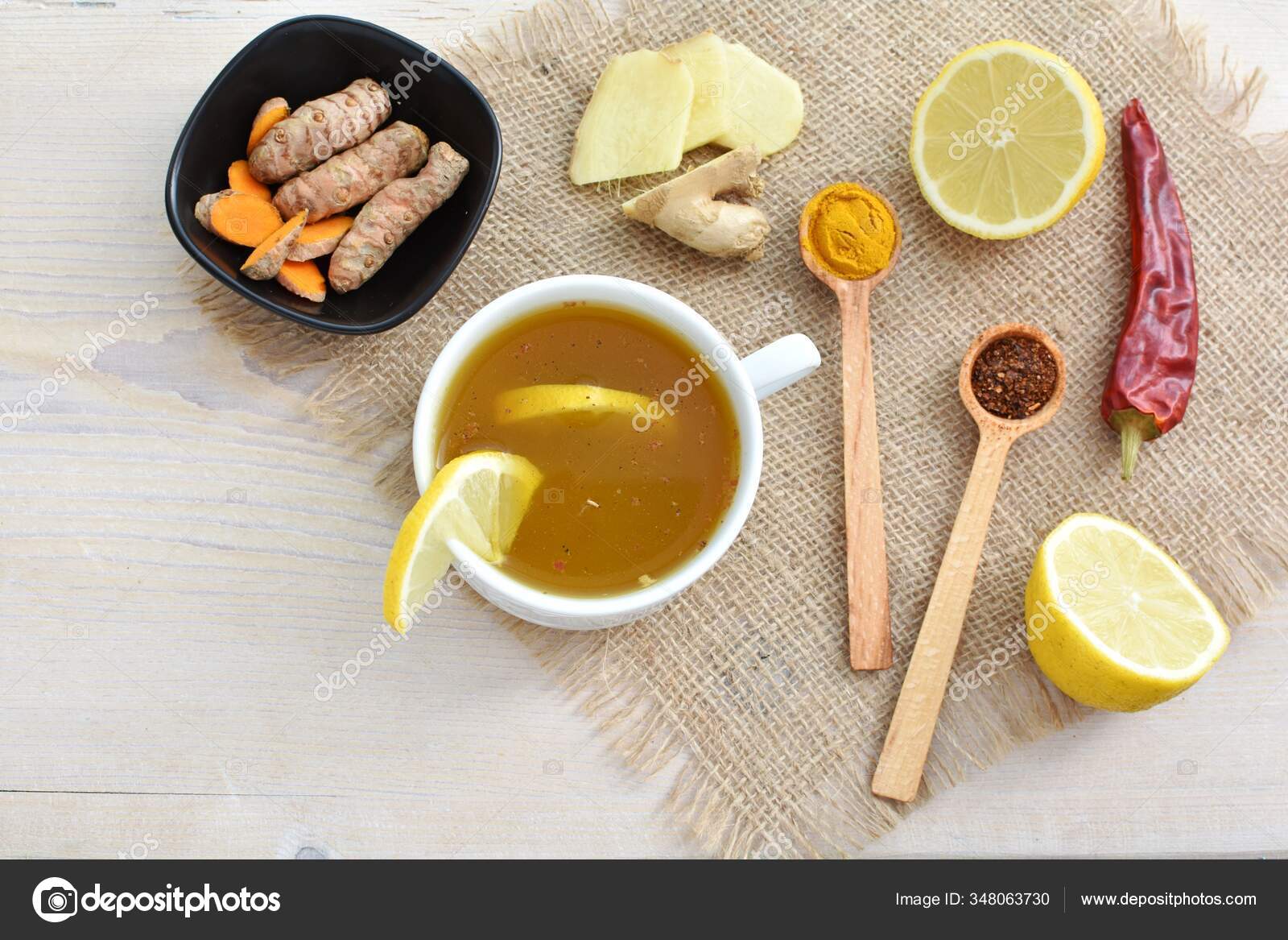 Spicy Detox Turmeric Tea Cup Lemon Ginger Chili Peppers Rustic Stock