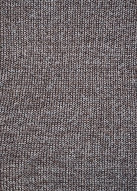 El örgüsü kahverengi yünden örülmüş bir kumaş parçası. Yukarıdan bak. Dikey.