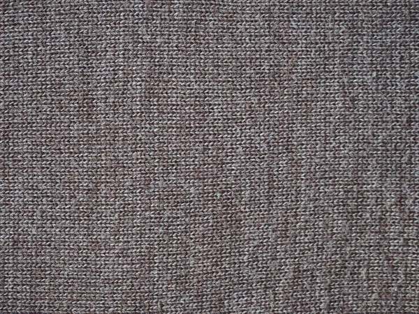 Fragmento de um tecido tricotado de lenço de lã marrom de malha manual. Vista de cima . — Fotografia de Stock