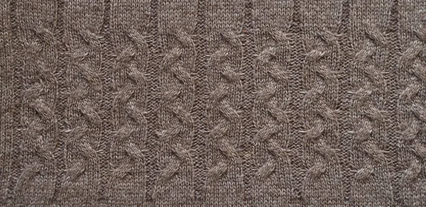 Fragment of a knitted fabric of handkerchief hand-knitted brown wool. View from above. — 스톡 사진